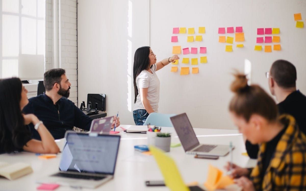 Agency team mapping out a client loyalty strategy together
